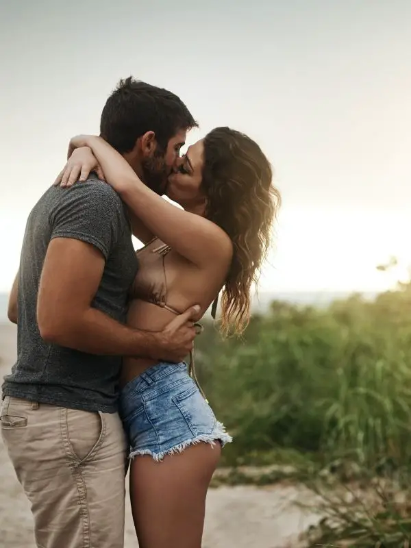 kissing on the beach